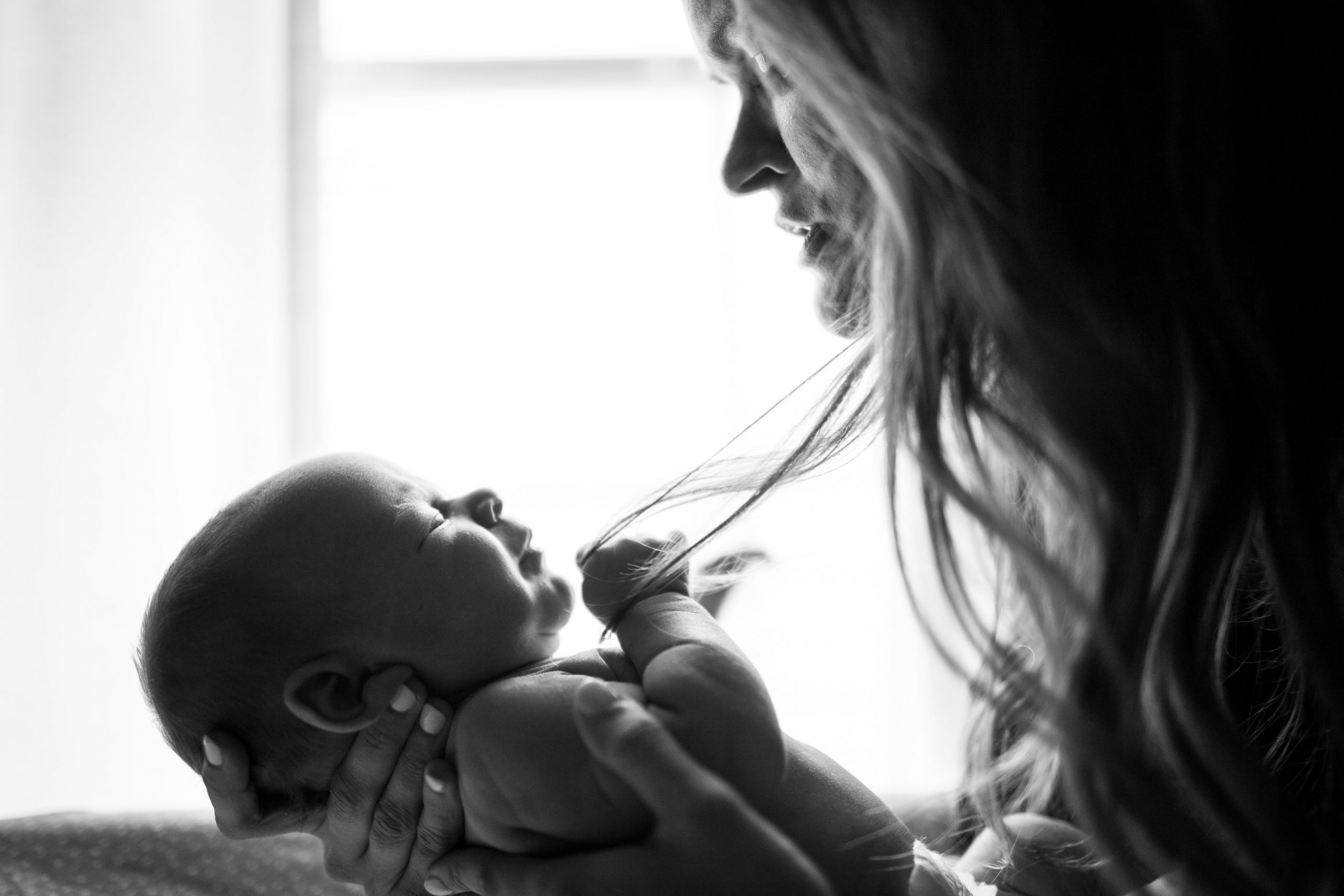 Newborn pulling mothers hair